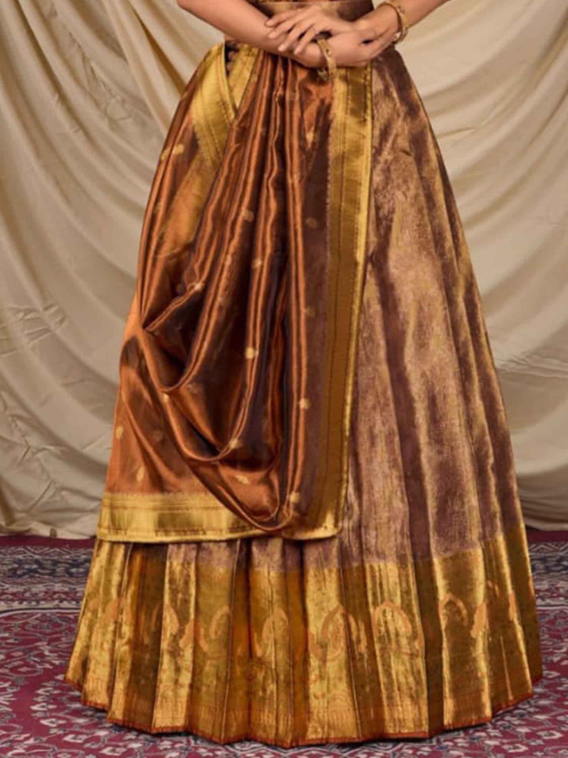 Womens Latest Lehenga Designs Tissue Peach Gold